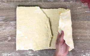 Pfeffer Orangen Rollen Rezept: Teig ausrollen und falten
